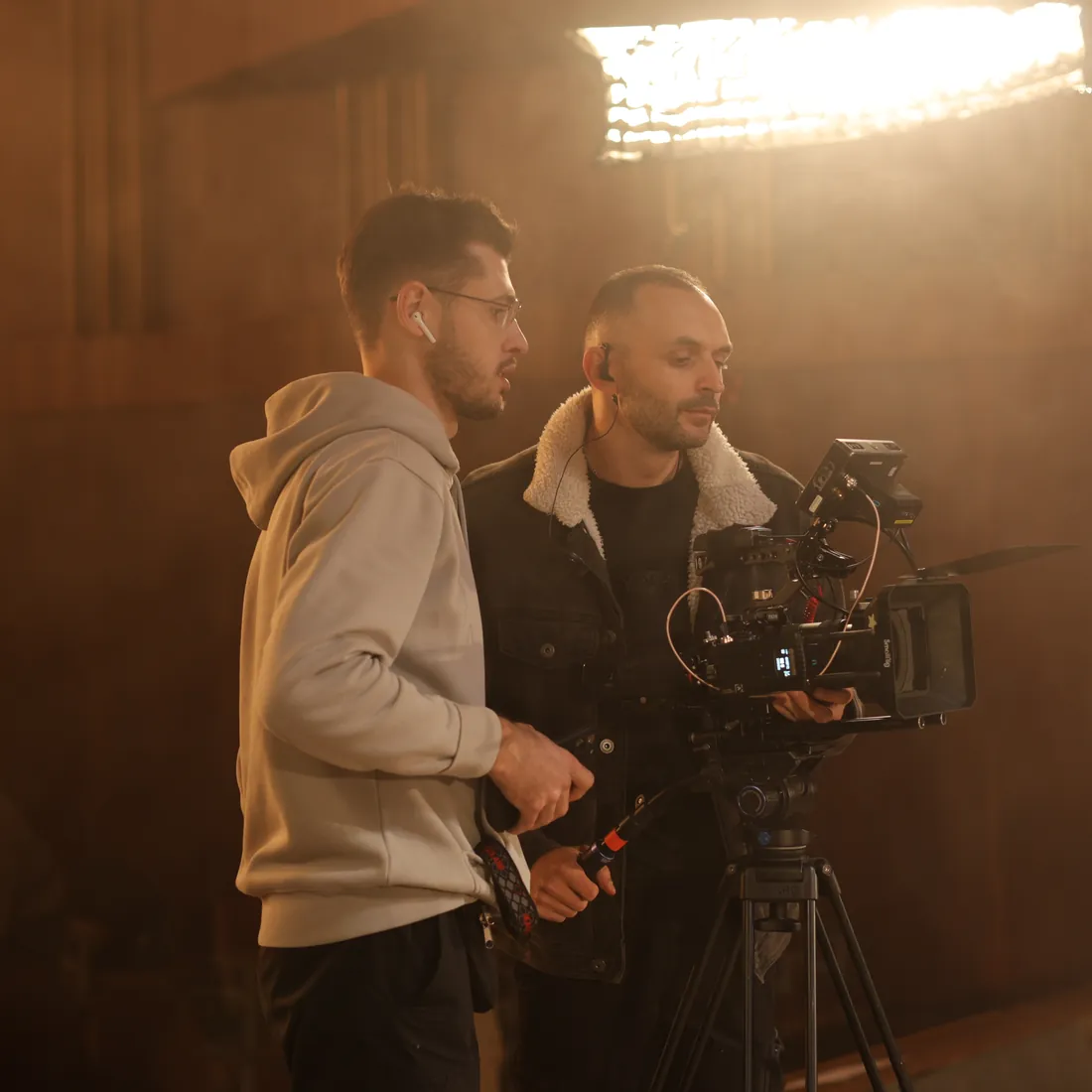Crew at the camera in warm light
