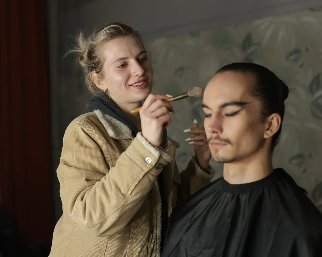 Make-up artist working with a model