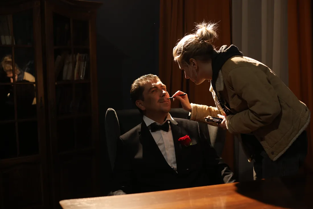 Make-up for an actor in a tuxedo