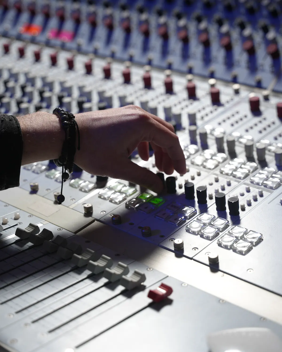 Hand on the console faders